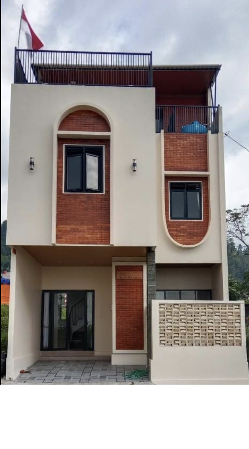 Tampak depan Villa Nyaman — bangunan 3 lantai dengan aksen brick